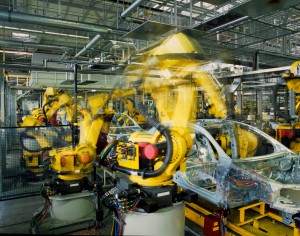 yellow robots welding cars in a production line, (c) Fotolia.com, RainerPlendl, 23546743